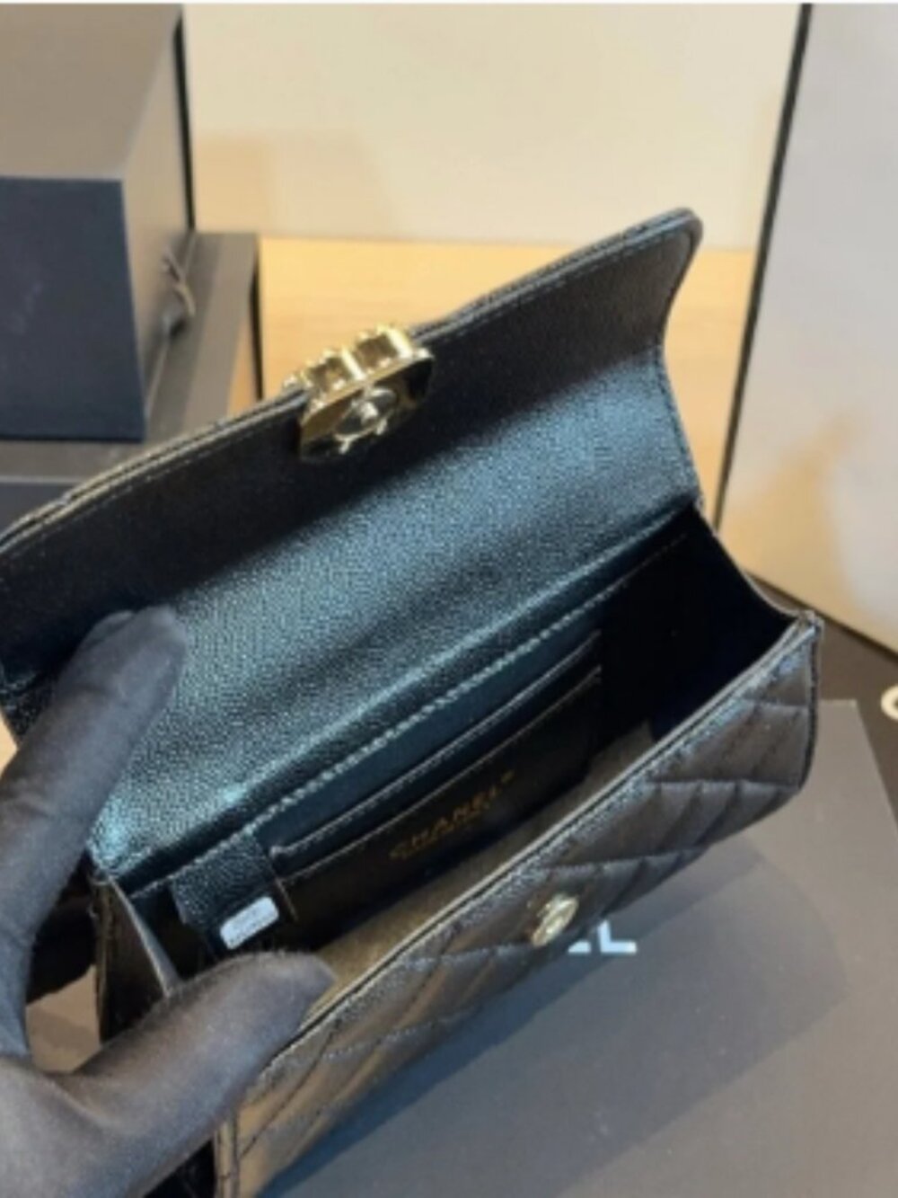 Quilted handbag with gold hardware